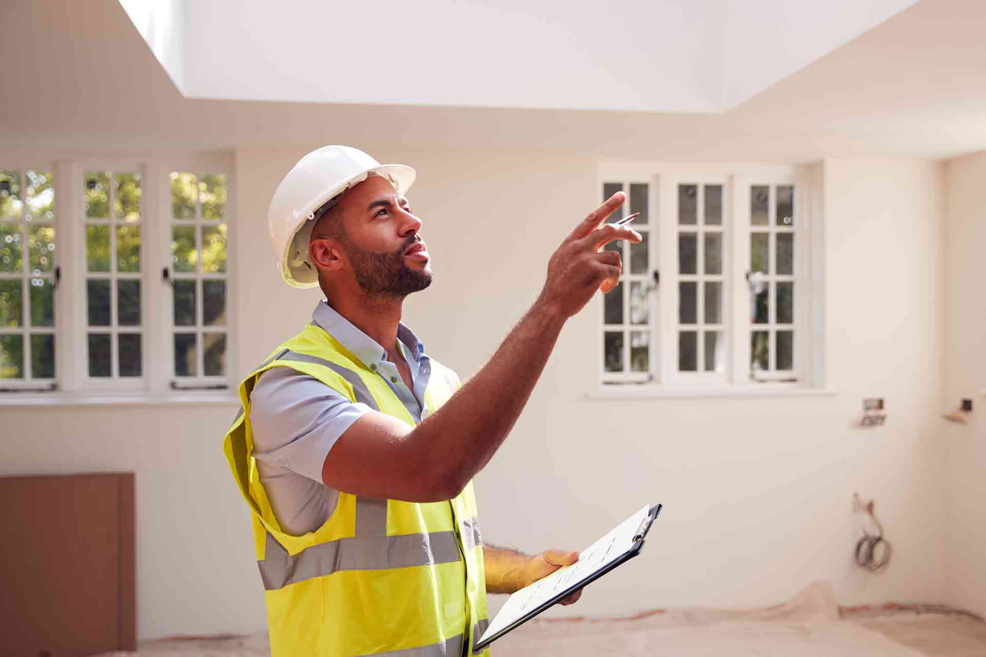 Third Party Wall Surveyors Portsmouth reviewing plans between two parties during a dispute